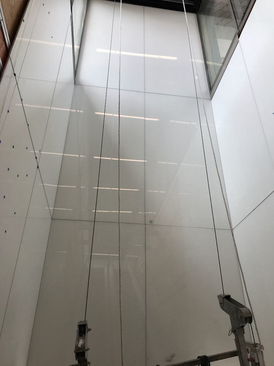 Handling a large glass panel with a suction lifter